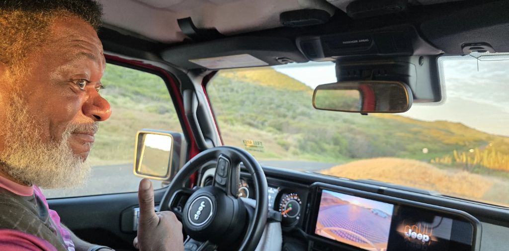 Rap Master Ricky gives a thumbs up in his rental Jeep on St. Croix, U.S. Virgin Islands